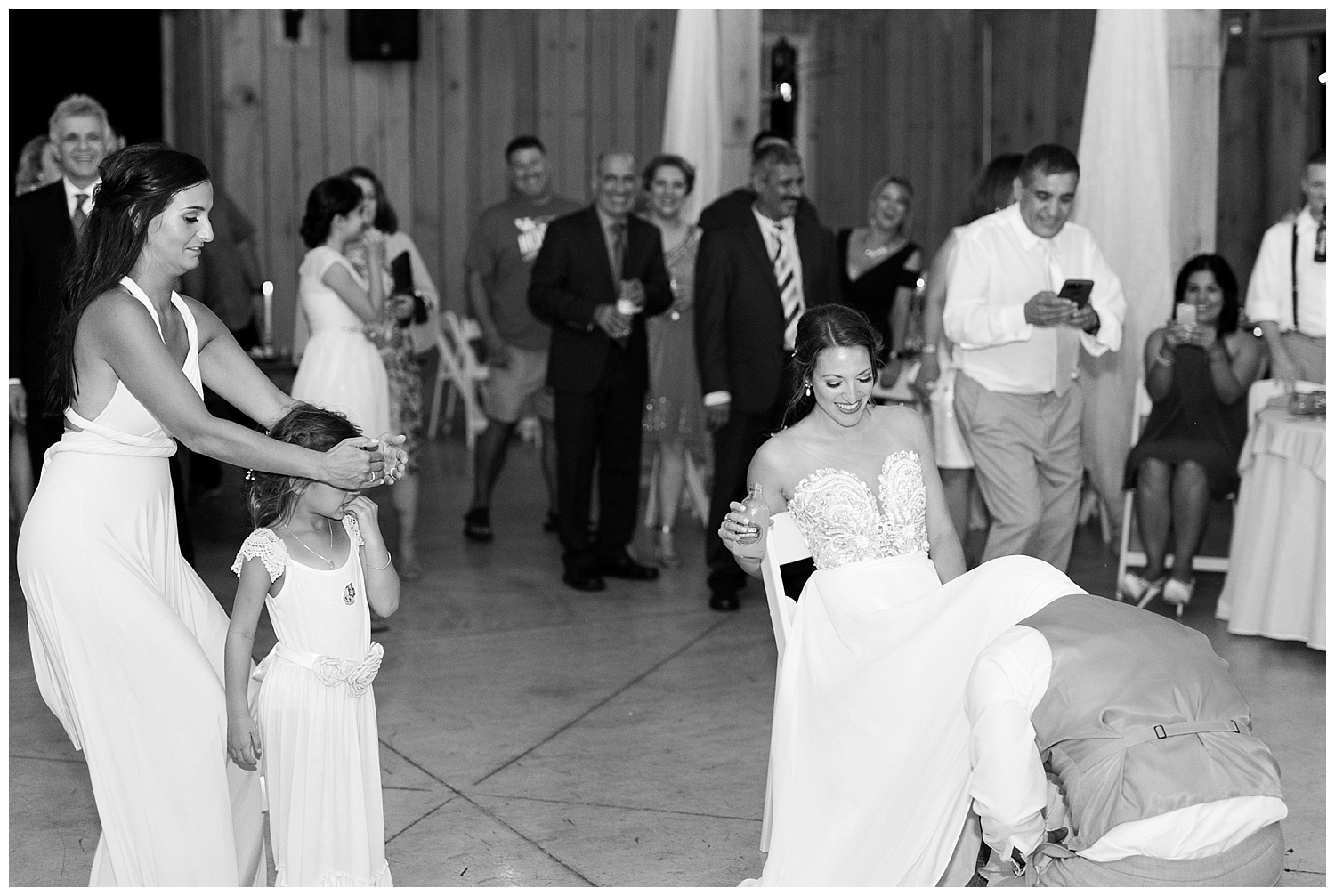  This might be my favorite garter toss shot! Those two to the left are the groom'a sister and niece!  