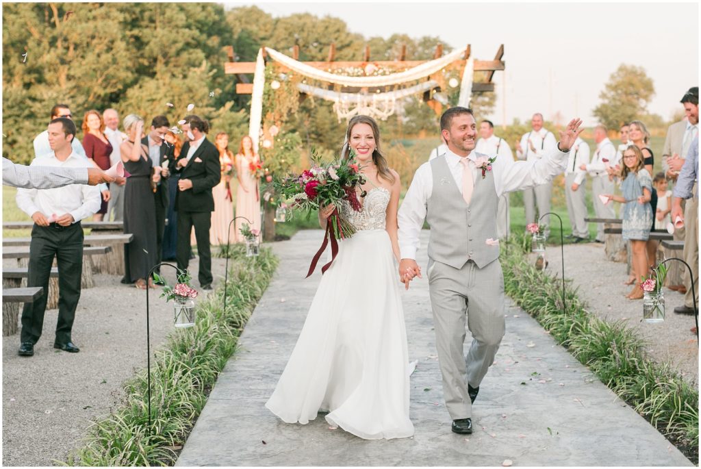 A bride and groom exiting their wedding ceremony at Elkins Grove in Smith Grove Kentucky 
