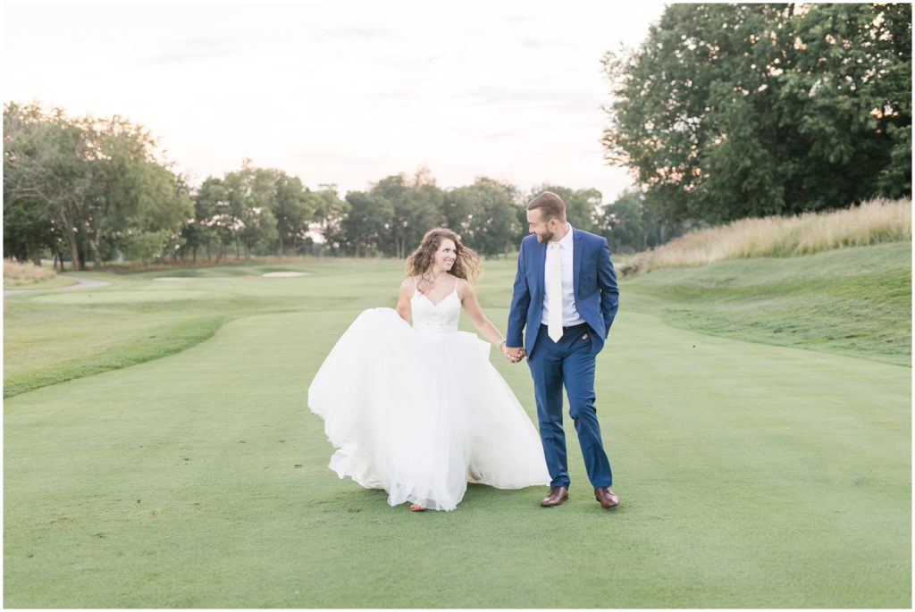 bride and groom smiling at each other on Keene Trace Golf Course