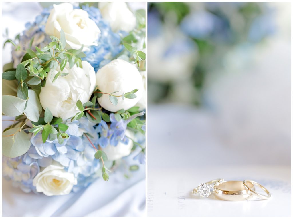 Right: bouquet featuring white and blue flowers as well as greenery. On the left, three rings are stacked on each other sitting on a wedding invitation with the bouquet of flowers out of focus in the background at a Georgetown Kentucky wedding.